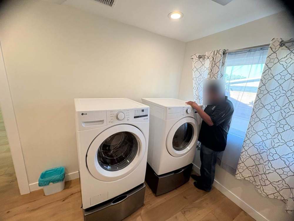 Photo 26 · Laundry utilities and exterior deck